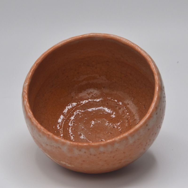 Top view of the Yoshimura Raku-nyu matcha bowl showing its glossy reddish-brown interior and softly irregular rim.