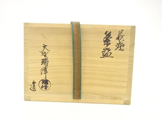 Exterior of the original wooden storage box with Japanese calligraphy, seals, and a woven securing cord for the Zuiho Ono Matsukaze chawan.