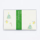Packaged Japanese rice paper with a Christmas tree and star design, labelled 'Kaishi Minou Washi' for tea ceremony.