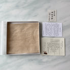 Handwoven hemp kobukusa with traditional Japanese packaging and artisan information